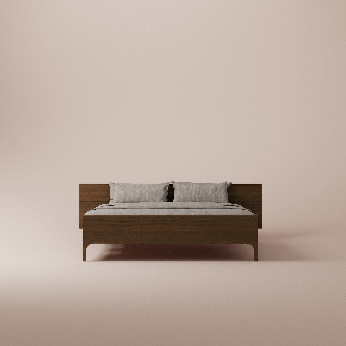Wooden bed with gray bedding on a beige background