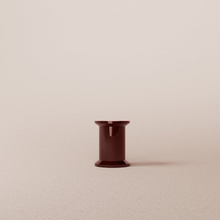 Dark red stool on a beige background