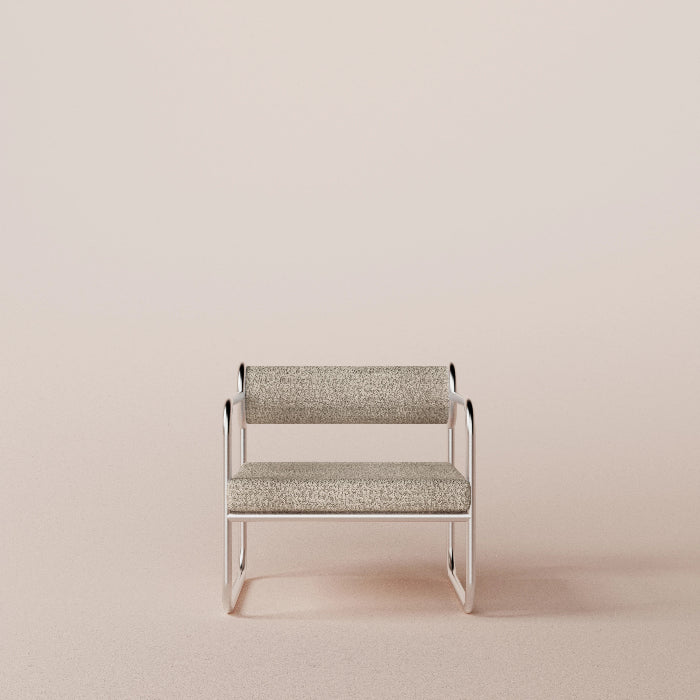 Modern chair with metallic frame and textured cushion on a beige background