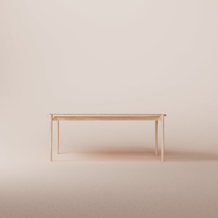 Minimalist wooden table against a plain beige wall