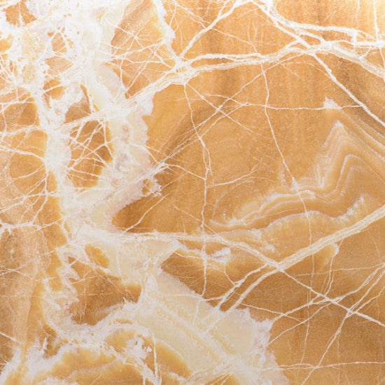 Close-up of a Yellow marble surface with white veins