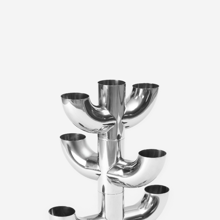 Silver candelabra with multiple bowls on a white background