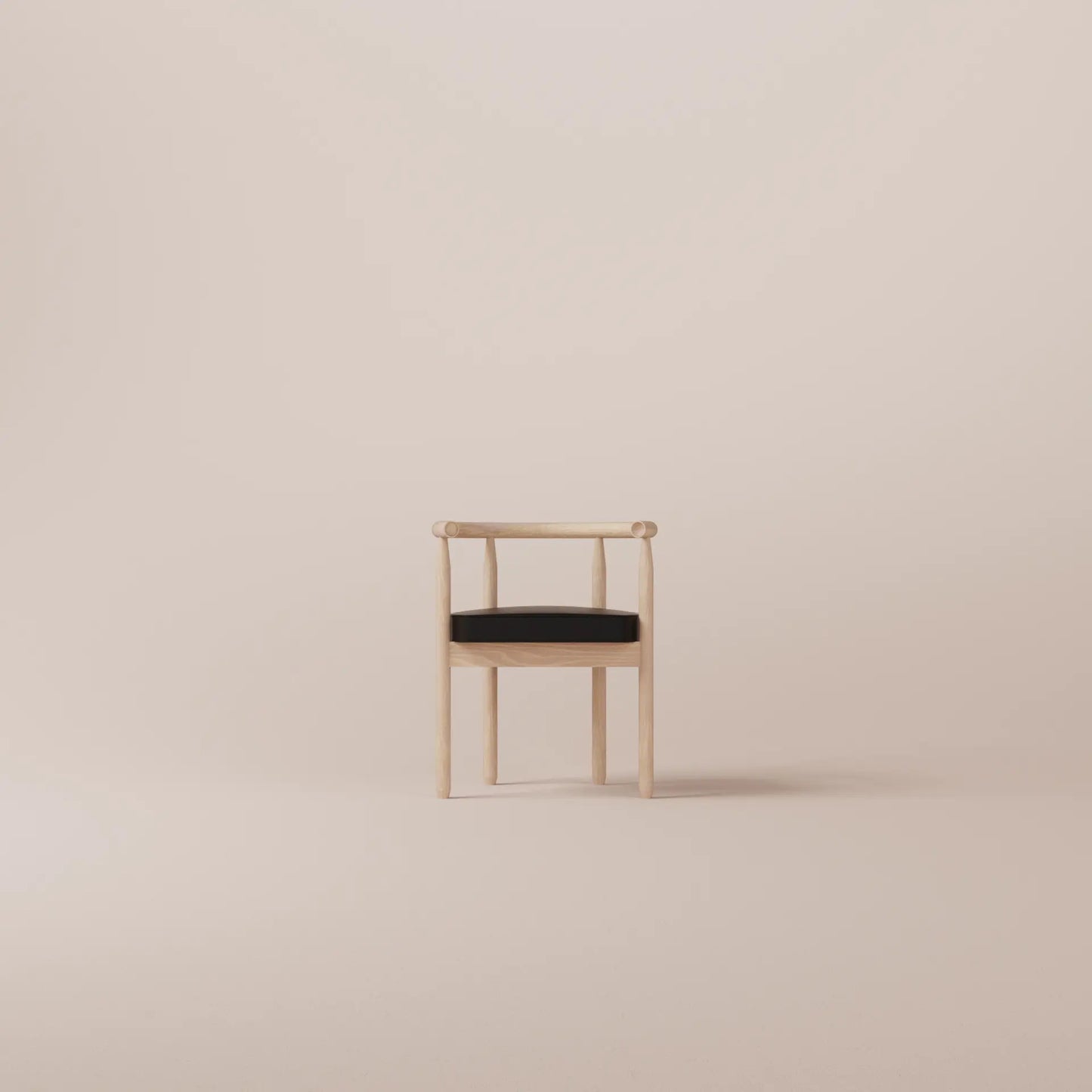 Minimalist chair with black cushion on a beige background