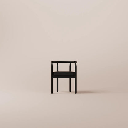 Black chair on a beige background