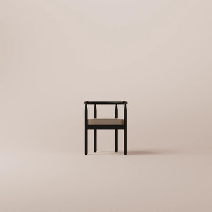 Black chair with a wooden seat on a beige background