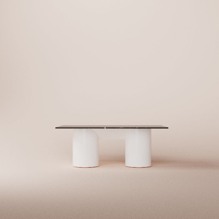 Modern dining table with white cylindrical legs on a beige background