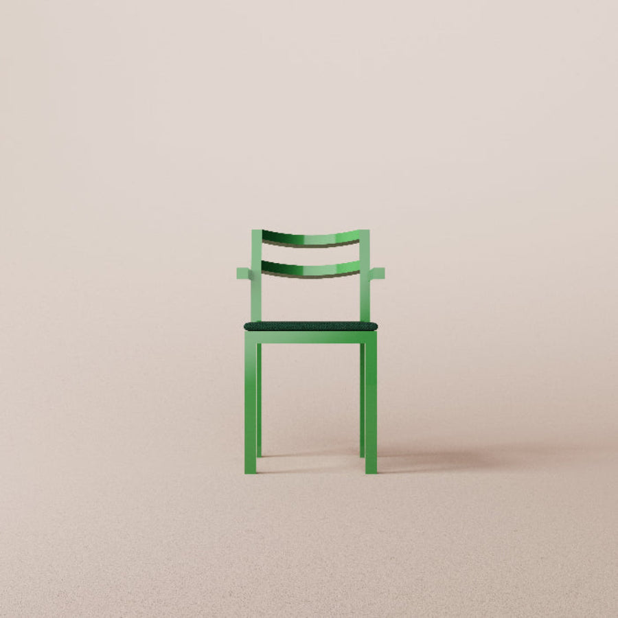 Green chair on a beige background