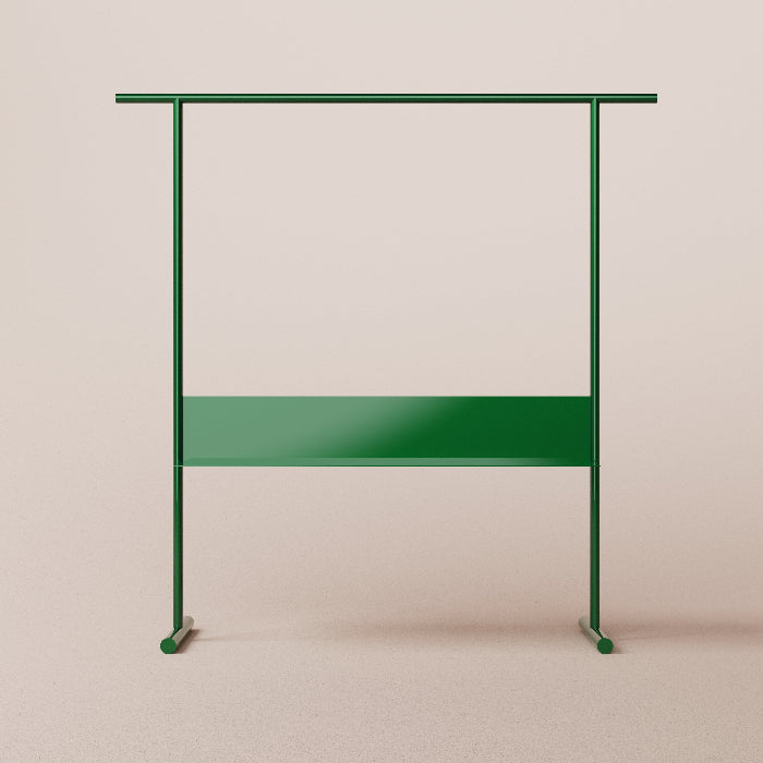 Green metal clothing rack on a beige background