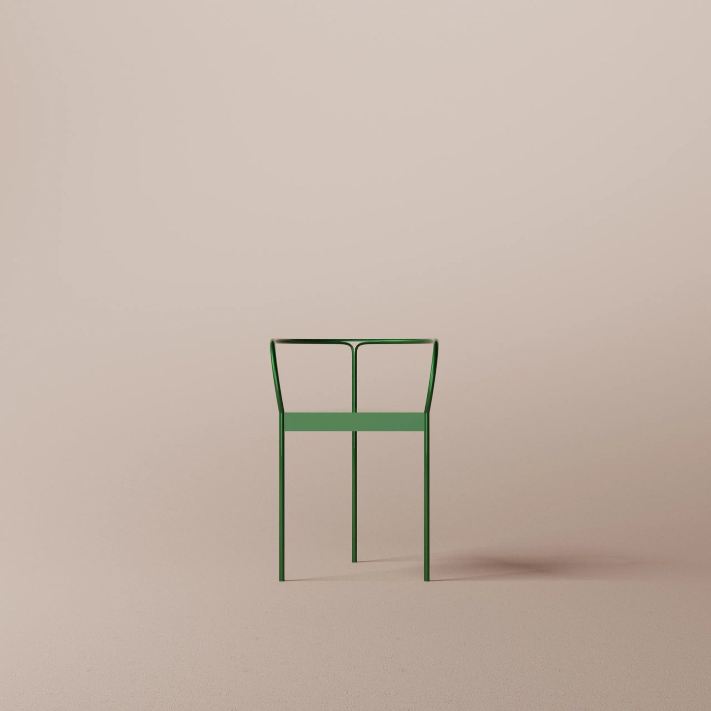 Green metal chair on a beige background