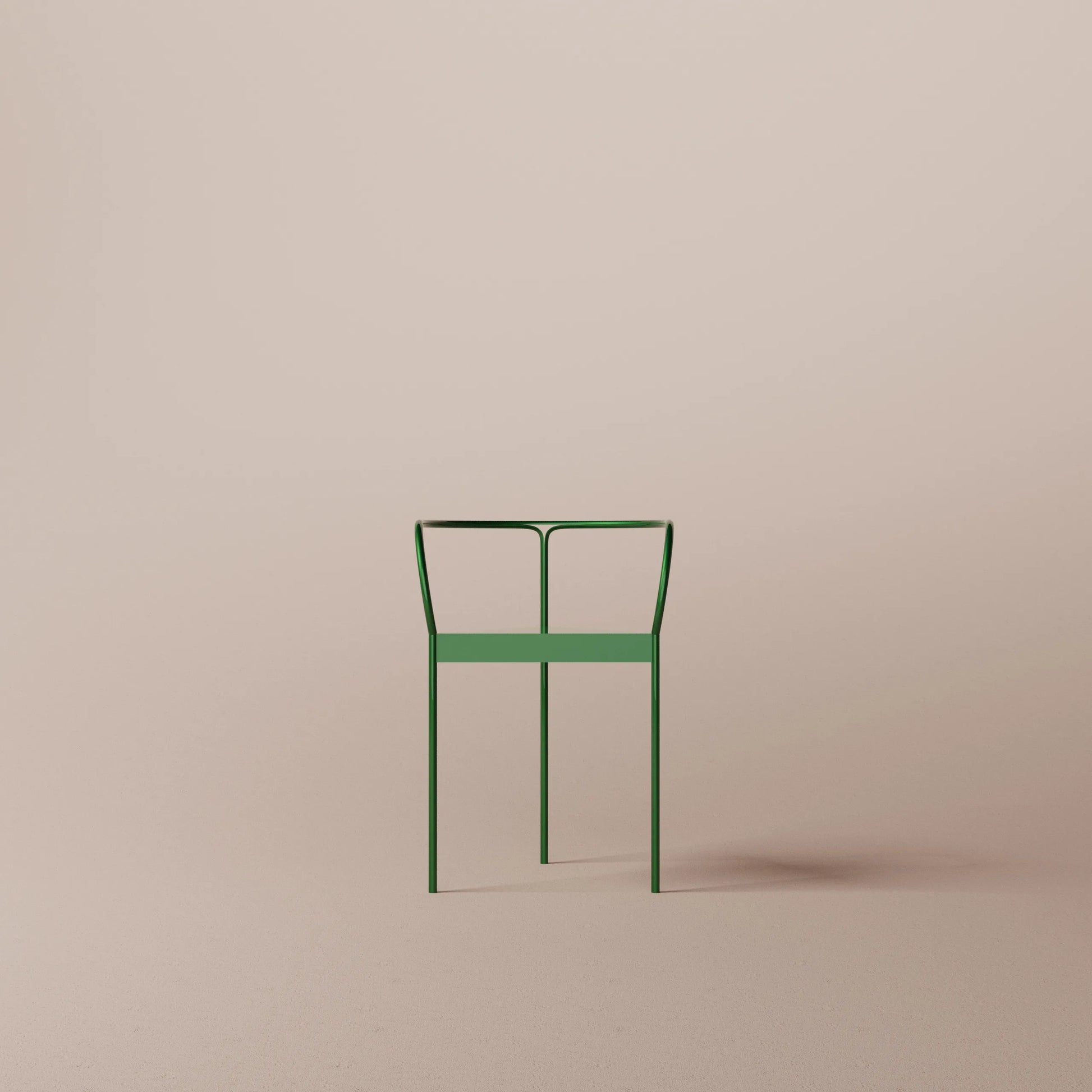Green metal chair on a beige background