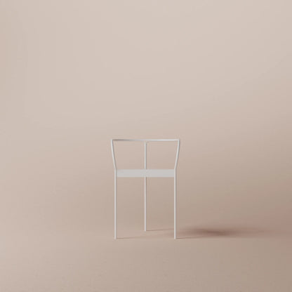 Minimalist metal chair on a beige background