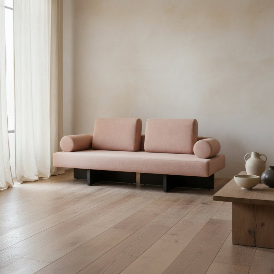 Beige sofa with wooden legs on a white background