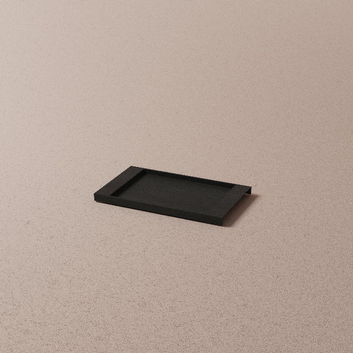 Black rectangular tray on a beige background