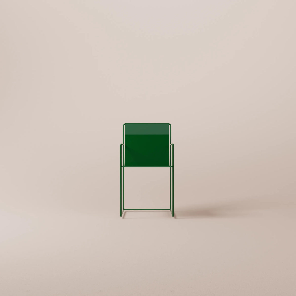 Green metal chair on a beige background