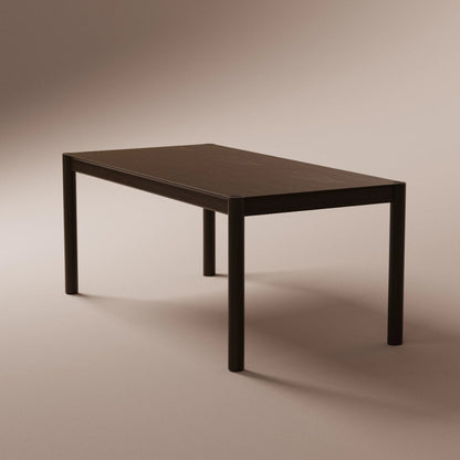 Solid walnut table on a beige background