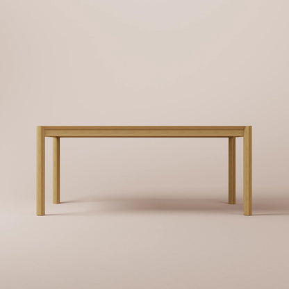 Solid Ash dining table on a beige background