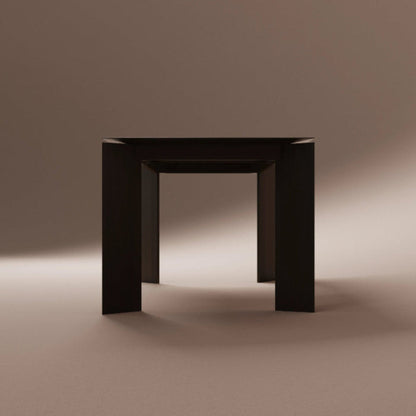 Solid walnut dining table on a brown background